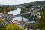 a commuter train is crossing the bridge over the river "Rhein" at Schaffhausen